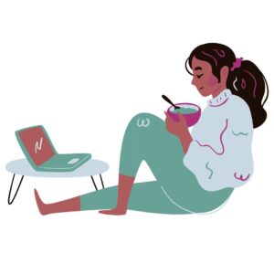 chronically ill girl drinking tea looking at laptop on floor desk