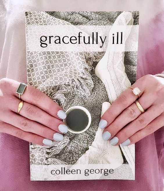 cover of gracefully ill by colleen george, girl's hands with rings holding book, pink sweatshirt